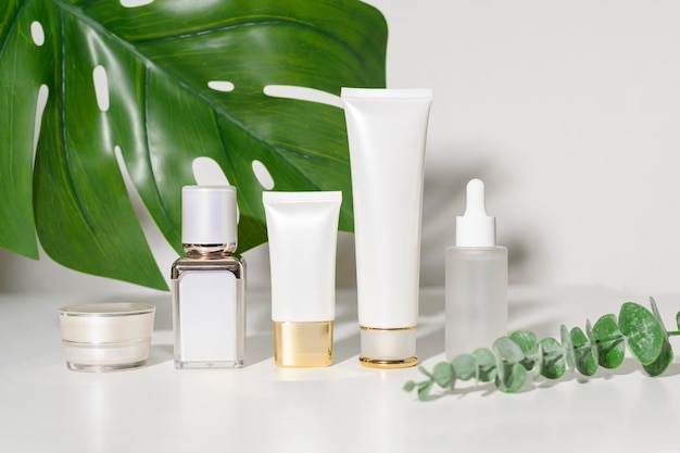 Moisturizing cream bottle over leaf background studio packing and skincare beauty concept