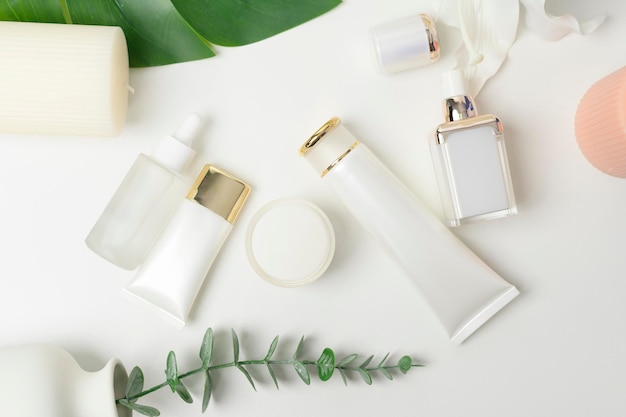 Moisturizing cream bottle over leaf background studio packing and skincare beauty concept