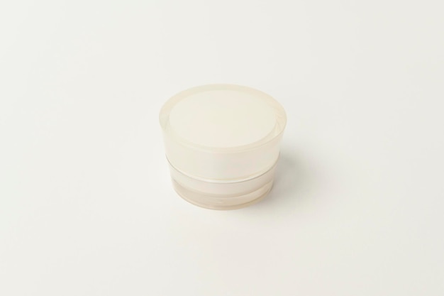 Moisturizing cream bottle over white background studio packing and skincare beauty concept