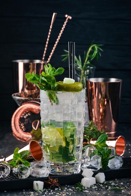 Mojito Alcoholic Cocktail On a black wooden background