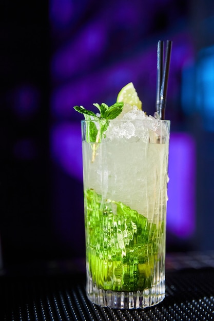 Mojito cocktail based on rum mint and lime on the bar counter\
of a nightclub