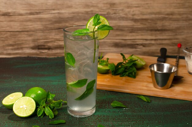 Mojito cocktail of Cuban origin on a green table