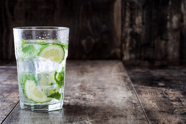 Mojito cocktail in glass on wooden