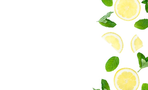 Mojito, lemonade cocktail or sour infused water ingredient. Flatlay with sliced lemon and mint leaves, copy space. High quality photo