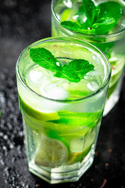 Mojito with mint castings Against a dark background