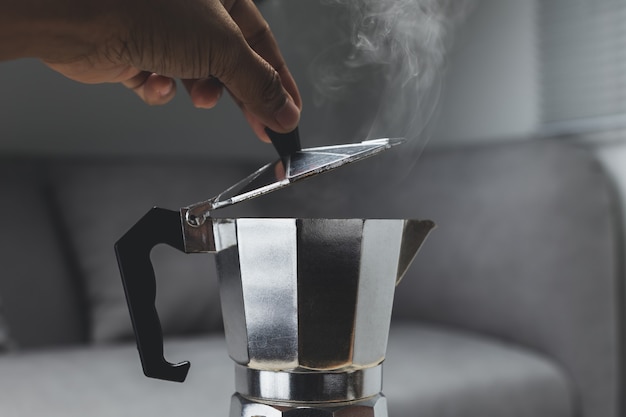 Photo moka pot espresso machine on the stove