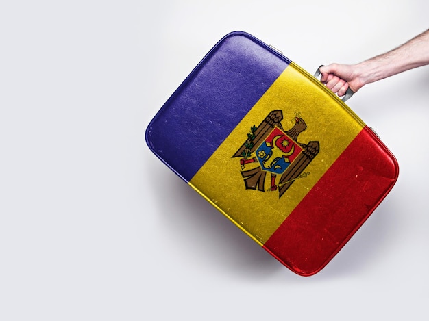 Moldova flag on a vintage leather suitcase