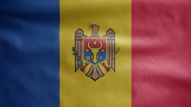 Молдавский флаг развевается на ветру. Знамя Молдавии развевает гладкий шелк. Ткань ткань текстура прапорщик