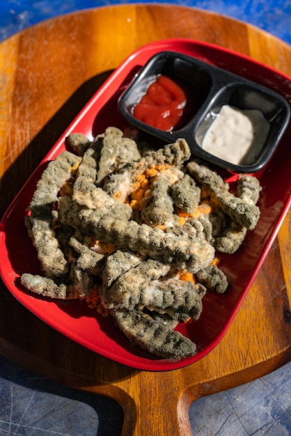 Moldy french fries closeup, fungal moldy on unhealthy old food\
on plate, bad food