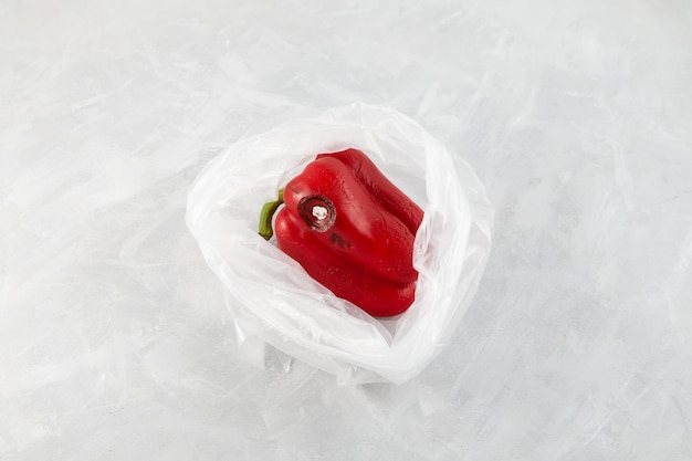 Photo moldy wrinkles red pepper in plastic bag improper food storage reduction of organic waste