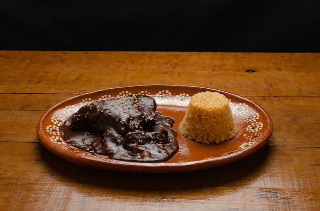 Mole typical Mexican food accompanied with rice