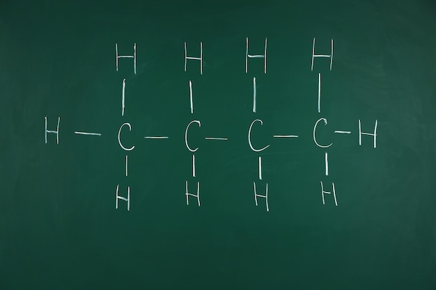 Molecule models and formulas on blackboard background