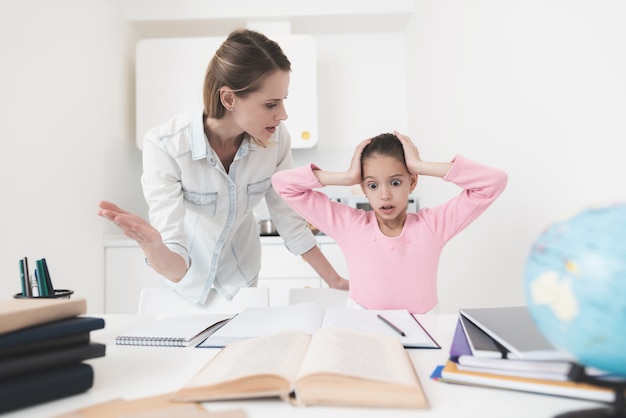 Mom and daughter are trying to solve the task.