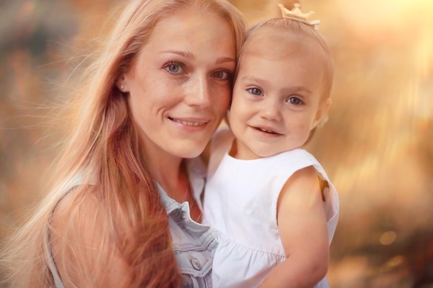 Mom daughter Autumn sunset portrait