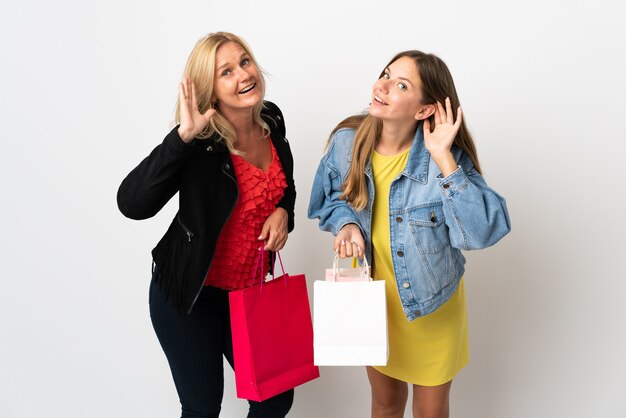 Mom and daughter buying some clothes