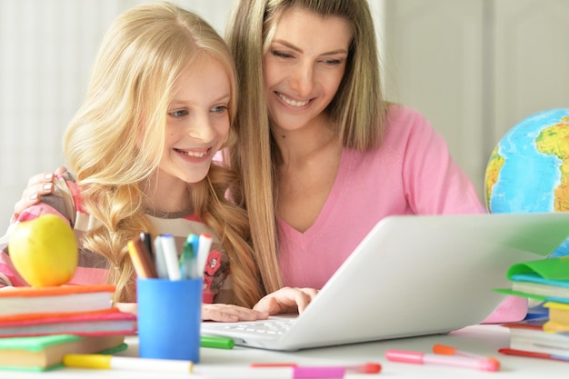 Mom and daughter doing lessons