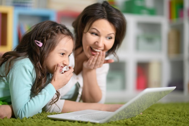 Mom and daughter playing on the floor