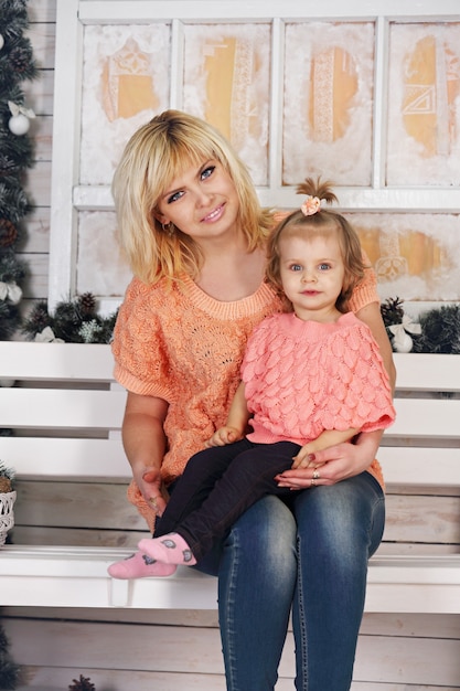 Mom and daughter on the porch decorated