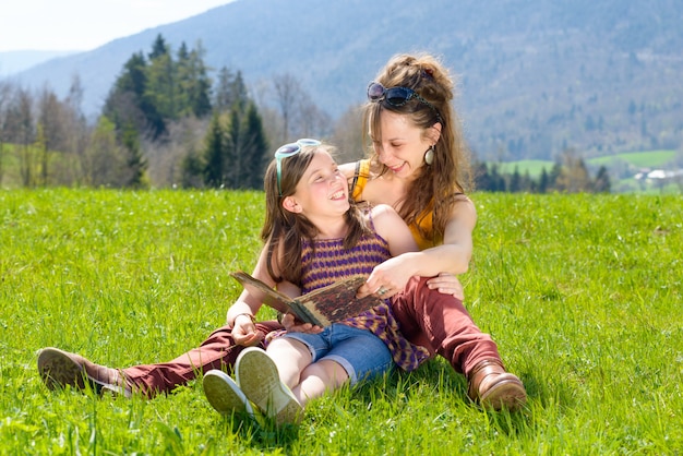 Mom and daughter reading a book