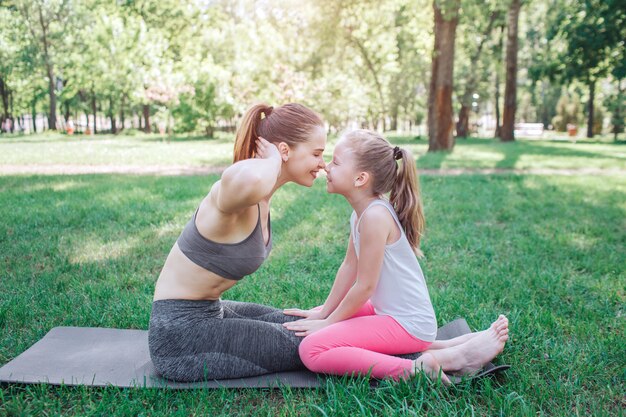 Mom and daughter sitting together face to face