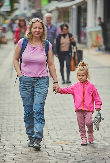 Mom and daughter walk around the city in the netherlands