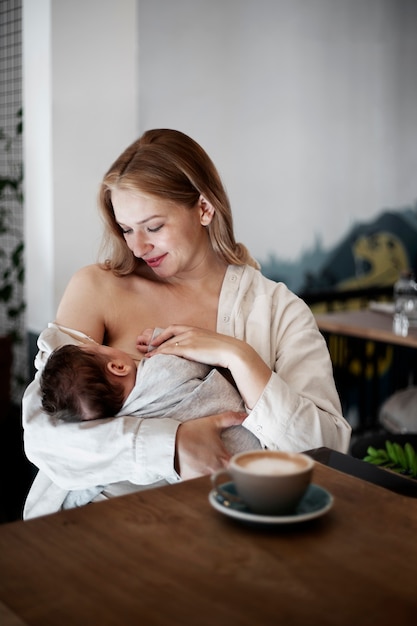 Mom gently breast feeding her child