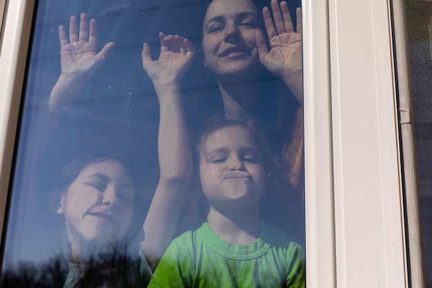 Mom and her daughters enjoy the spring weather indoor