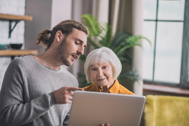 Mom and her son looking on laptop