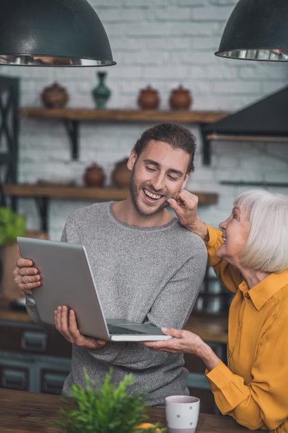 Mom and her son looking on laptop