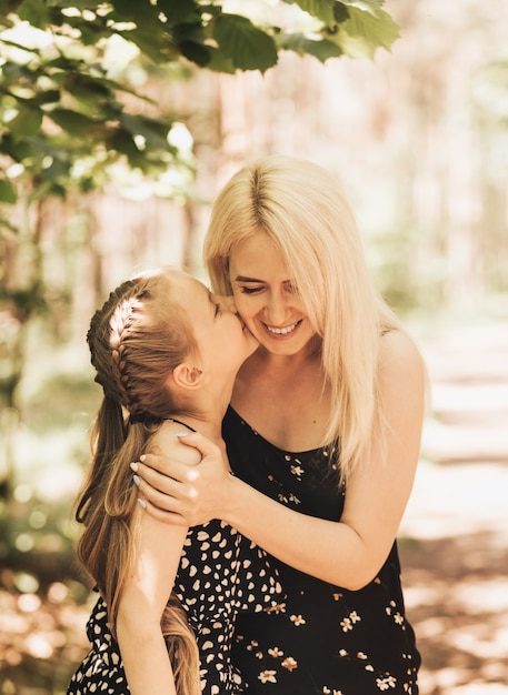 Mom holds a little girl daughter