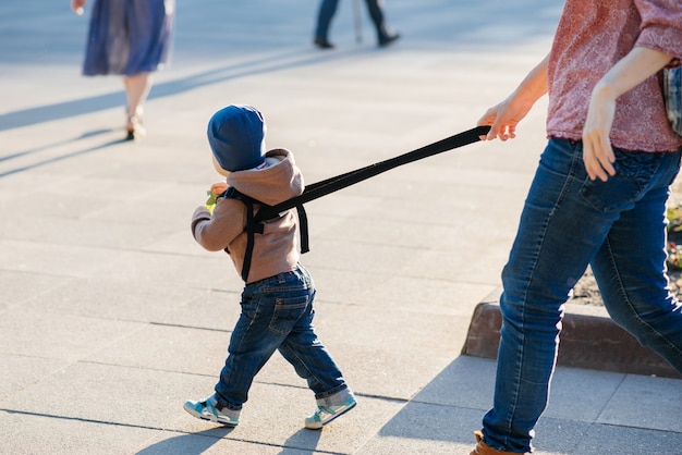  Mom insures her child during a walk