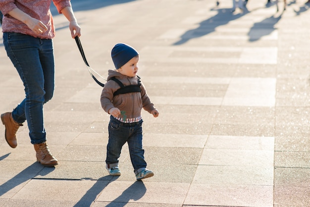  Mom insures her child during a walk