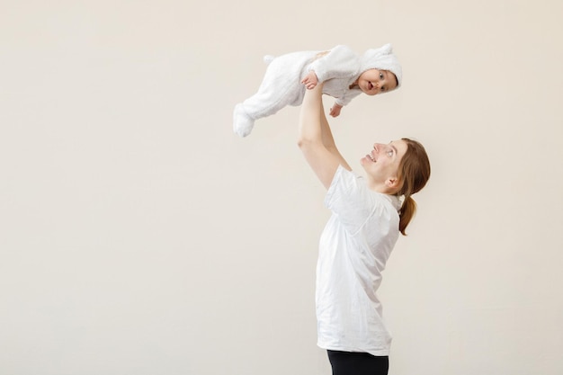 Mom is happy with the baby on a bright background