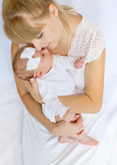 Mom is holding a newborn baby