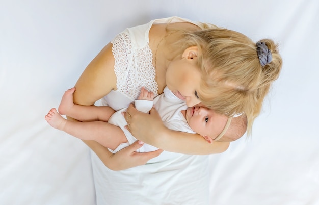 Mom is holding a newborn baby