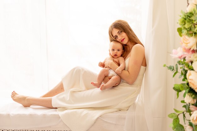 Mom playing with baby at home