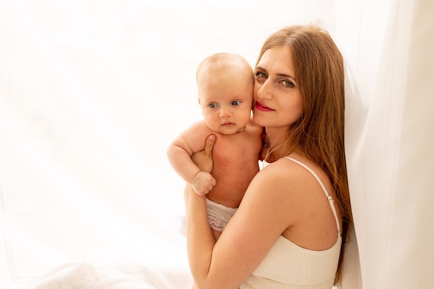 Mom playing with baby at home