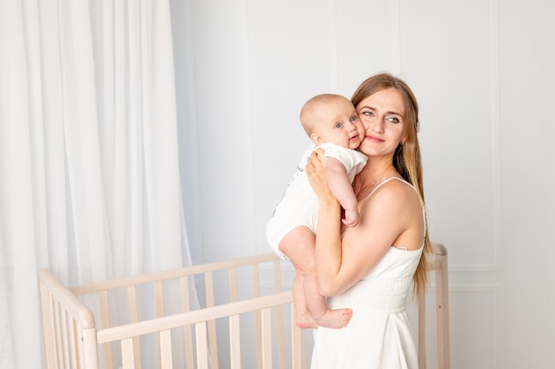 Mom playing with baby at home