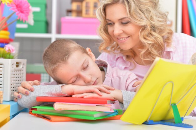 Mom and son doing lessons