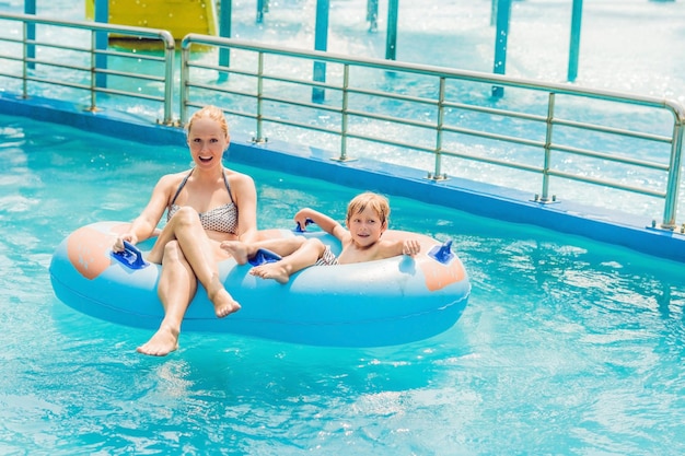 Mom and son have fun at the water park.