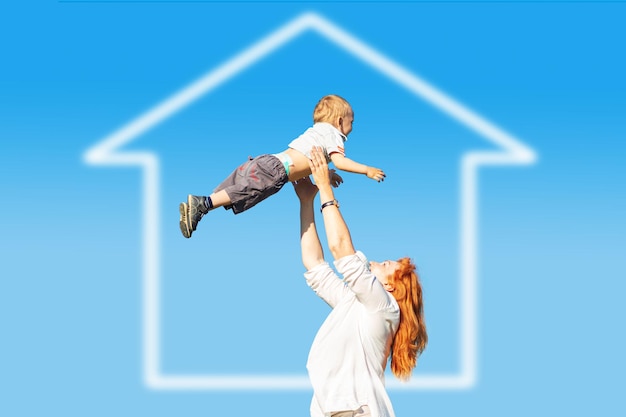 mom-and-son-play-in-the-field-and-dream-of-a-home-stock-image