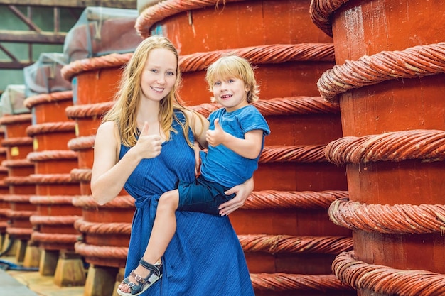 Mom and son travelers show how they like fish sauce on Phu Quoc, Vietnam