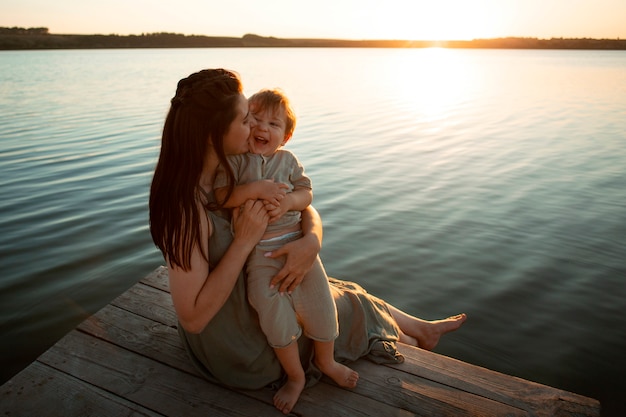 Mom spending time with kid at the beach