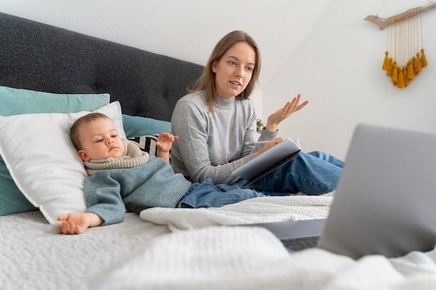 Mom taking care of her child and teleconsulting with doctor