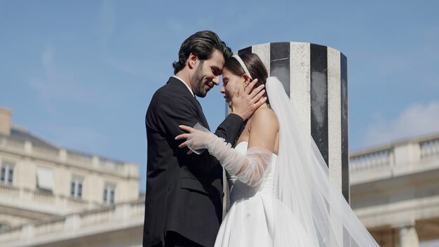 The moment of the wedding action two young men in elegant wedding suits hug and flirt with happy