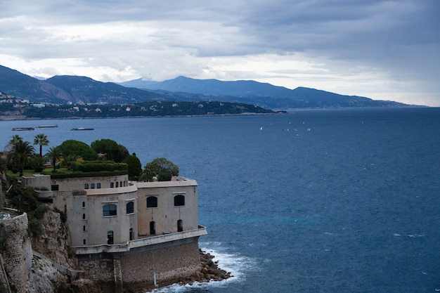 Monaco coastline with bastion with rainy clouds, storm is coming.