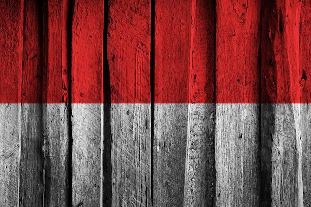 Monaco flag on background of old wooden planks