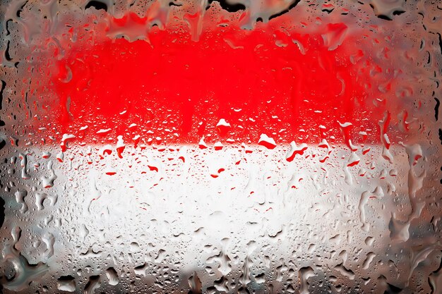 Monaco flag Monaco flag on the background of water drops Flag with raindrops Splashes on glass