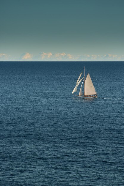 Monaco lonely vintage sail yacht in sea at sunset huge sail boat wealth life of billionaires