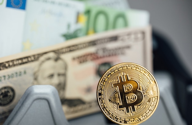 money background. usa dollar with euro banknotes and bitcoin cryptocurrency investing concept.